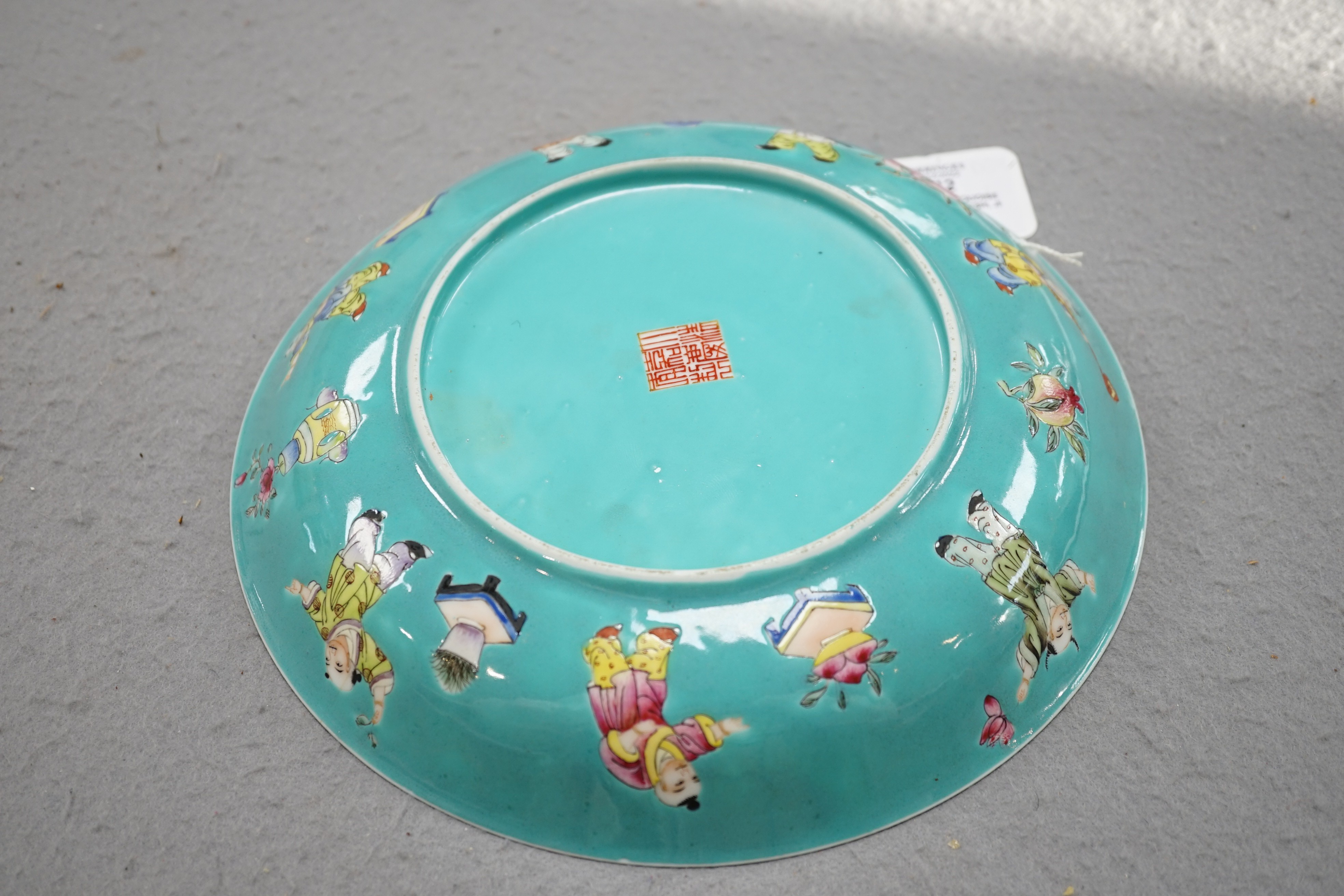 A Chinese turquoise ground 'Boys' dish, Jiaqing seal mark but Republic period, 23.5cm diameter, two hairline cracks